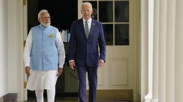 PM Modi, US President Joe Biden walk onto along the Colonnade to the Oval Office after a State Arrival Ceremony on the South Lawn of the White House