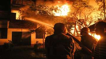 Firefighters try to douse fire that was set in houses of Kuki-Zo community by miscreants in Manipur on Aug 1