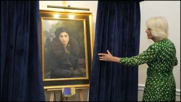 Britain's Queen Camilla unveiling the portrait of Noor Inayat Khan at RAF Club on Tuesday.