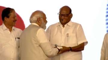 Sharad Pawar shares stage with PM Modi