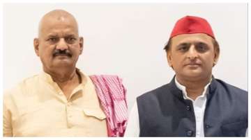 Samajwadi Party's candidate Sudhakar Singh along with party chief Akhilesh Yadav