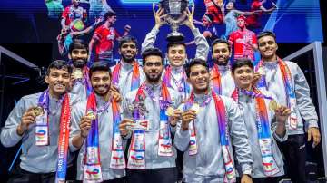 Indian men's badminton team posing with the Thomas Cup