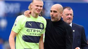 Manchester City's Erling Haaland and Pep Guardiola during an EPL game against Everton in May 2023