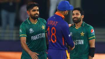 Virat Kohli with Pakistan batters Babar Azam and Mohammad Rizwan during ICC T20 World Cup 2021