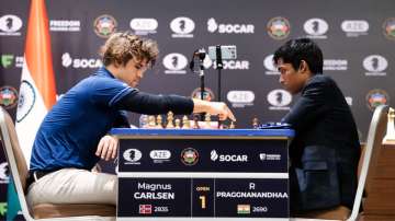 Rameshbabu Praggnanandhaa and Magnus Carlsen during game 1 of the final