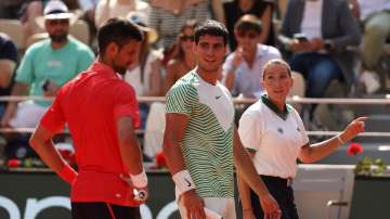 Novak Djokovic and Carlos Alcaraz during the French Open semi-final match in June 2023