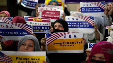 Hundreds of Afghan refugees facing delays in approval of U.S. visas protested in Islamabad