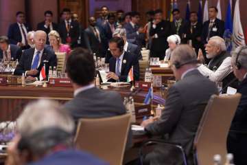 Prime Minister Narendra Modi speaks as U.S. President Joe Biden, left, with other leaders listen during the first session of the G20 Summit in New Delhi