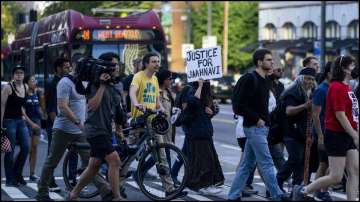 Protesters march against 23-year-old Jaanhavi Kandula's death and the officer's remarks