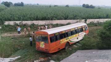 Bus falls down the slope after colliding with railing 