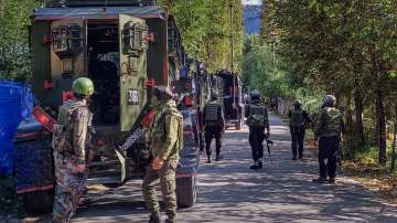 Security personnel during the ongoing gunfight with terrorists, at Gadol Kokarnag in Anantnag district