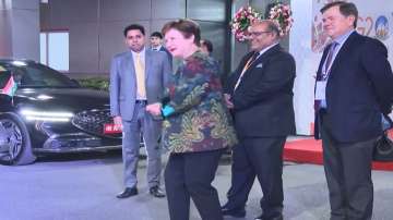 g20 summit 2023, g20, IMF Chief Kristalina Georgieva shakes leg with folk artists, Delhi airport, im