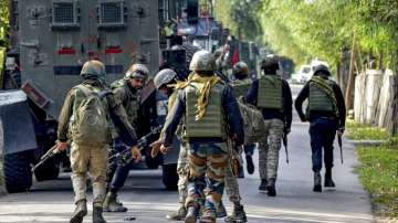 Security personnel during an encounter with terrorists at Gadole area of Kokernag, in Anantnag district