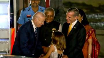 US President Joe Biden being received by Union Minister of State VK Singh, US Ambassador to India Eric Garcetti and others upon his arrival at Indira Gandhi International Airport to attend the G20 summit, in New Delhi