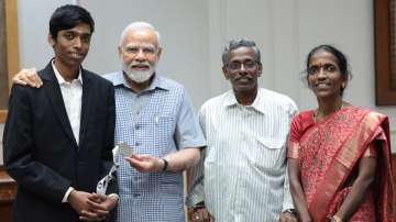 R Praggnanandhaa and his parents with PM Modi