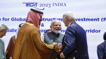 Saudi Arabian Crown Prince Mohammed bin Salman Al Saud, left, and US President Joe Biden, right, shake hands next to Prime Minister Narendra Modi on the day of the G20 summit in New Delhi