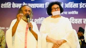 Indian spiritual leaders Sri Sri Ravi Shankar and Acharya Lokesh Muni (Right)