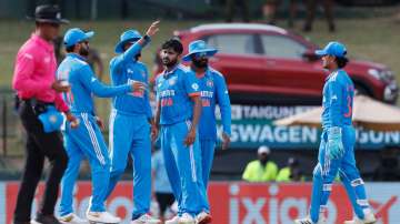 Indian cricket team celebrates a wicket