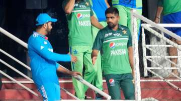 Rohit Sharma and Babar Azam shaking hands with each other
