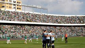 Argentina players in a team huddle