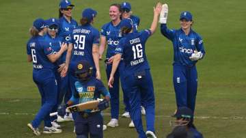 Lauren Filer celebrates a wicket with her teammates