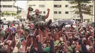 Soldiers cheering for Gen. Brice Oligui Nguema after the military coup in Gabon