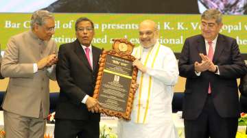 Union Home Minister Amit Shah presents the awards to Nariman and Venugopal