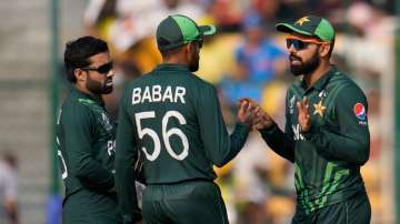 Pakistan captain Babar Azam during discussion with wicketkeeper batter Mohammad Rizwan and Shadab Khan