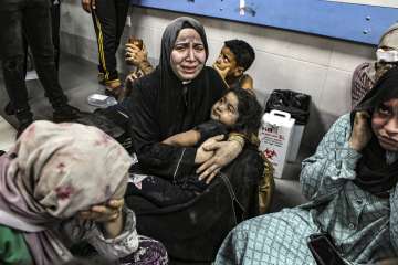 Family members mourn the death of their loved ones in the Gaza hospital bombing.