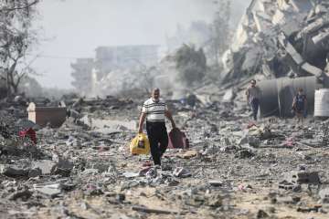 Israel-Hamas war: A person walking through the rampaged residential region in Gaza.