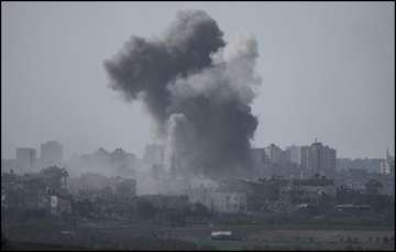 Smoke rises from a building in Gaza after Israeli airstrikes