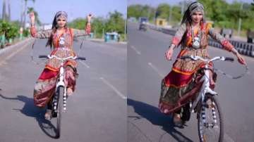 Woman in Garba costume performs skipping while riding bicycle 