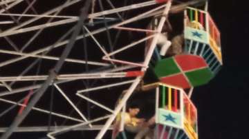 50 people left stranded after giant wheel stops rotating mid-air.