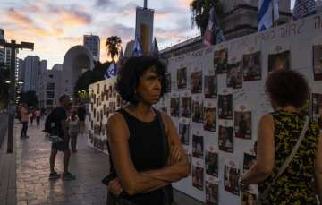 A wall of Israelis missing or taken hostages by Hamas in Tel Aviv