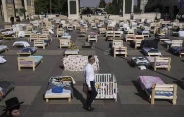 Beds displayed in Jerusalem to symbolise those captured by Hamas militants