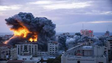 Fire and smoke rises following an Israeli airstrike, in Gaza City