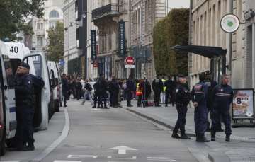 Police block the area where a teacher was killed by a man in France