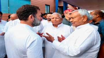 Congress leader Rahul Gandhi with Bihar CM Nitish Kumar, RJD chief Lalu Prasad