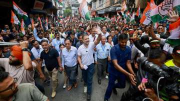 Congress leader Rahul Gandhi waves at supporters during a Padyatra from Chanmari to Raj Bhawan, in Aizawl, Mizoram.