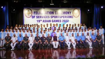 Defence Minister Rajnath Singh poses for group photos with the Asian Games Medal winners of India's 