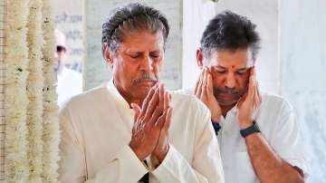 Kapil Dev and Kirti Azad attend Bishan Singh Bedi's last rites.