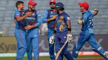 Afghanistan players celebrate after the dismissal of Pathum Nissanka.