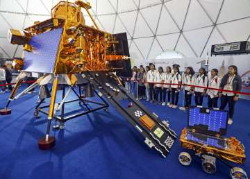 Student stand near a model of Chandrayaan-3 missions Vikram lander