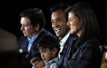 Indian American presidential aspirant Vivek Ramaswamy with his son and GOP rivals at 'The Family Leader' forum.