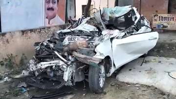 The image of the completely damaged car after the accident. 