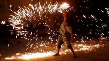 A child bursts firecrackers on the ocassion of Diwali.