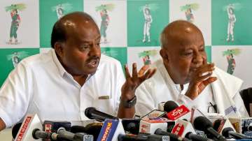 Former prime minister and JD(S) supremo HD Deve Gowda and former Karnataka chief minister HD Kumaraswamy address a press conference.