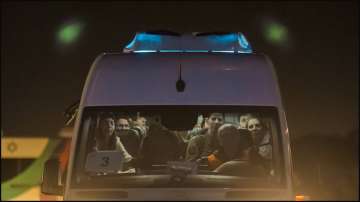 A minibus carrying Israeli hostages released by Hamas.