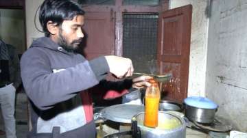 Hot Khichdi being packed in cylindrical bottles for trapped labourers
