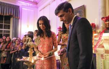 UK PM Rishi Sunak and his wife Akshata Murty lighting Diwali lamps at 10 Downing Street.